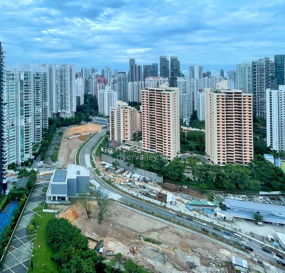 Aerial view of a complex indoor labyrinth made of concrete walls.